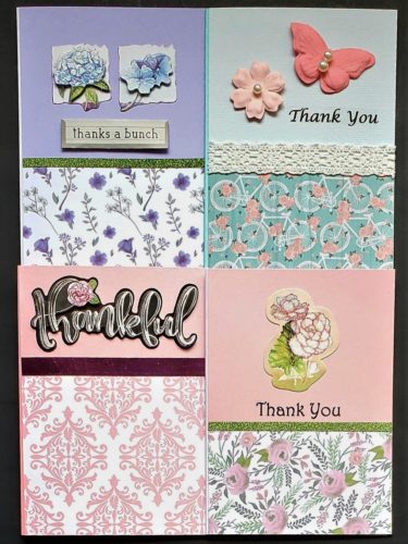 Four pack of thank you cards with two floral, one damask and one bicycle print.