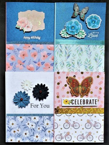 Four pack of birthday and mixed use cards in blue and pink florals and bicycles.