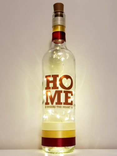 Bottle light with the phrase, "home is where the heart is".