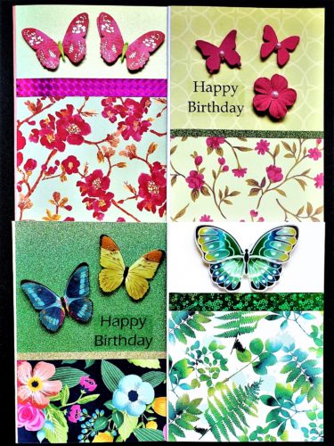 Four pack of mixed use and birthday cards featuring floral and foliage prints and decorated with different styles of butterflies.