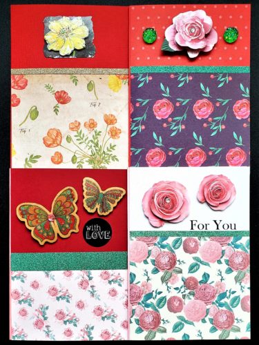 Four pack of multipurpose cards in different shades of red and pink, and decorated with layered flowers and butterflies.