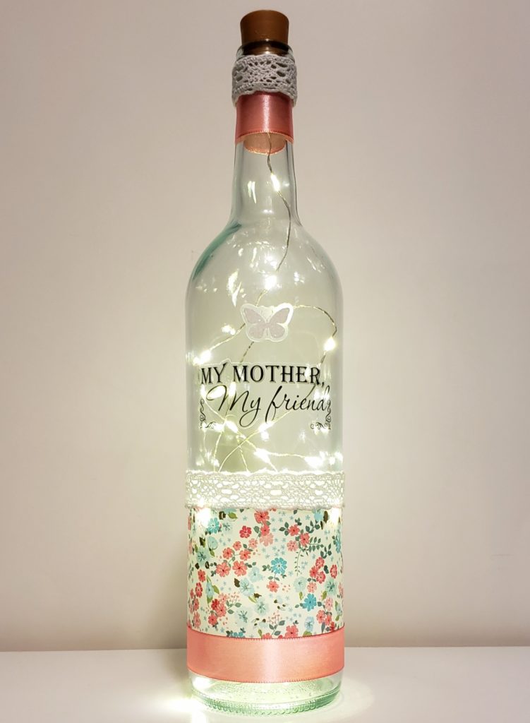 Bottle light with a white butterfly, floral wrap and the phrase, "My mother, my friend".